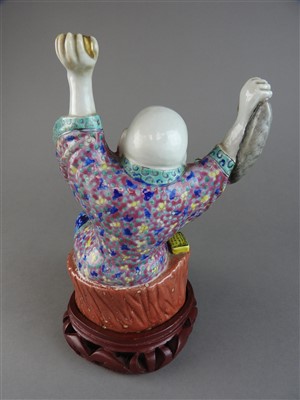 Lot 8 - A Chinese famille rose porcelain figure of Hotei