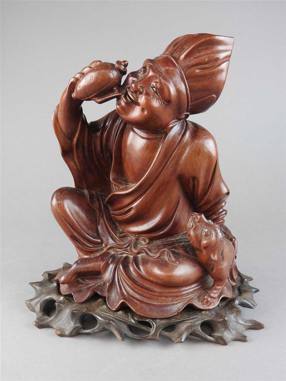 Lot 16 - A Chinese carved boxwood figure of a...