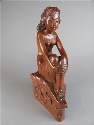 Lot 528 - A Chinese carved boxwood figure of a seated...