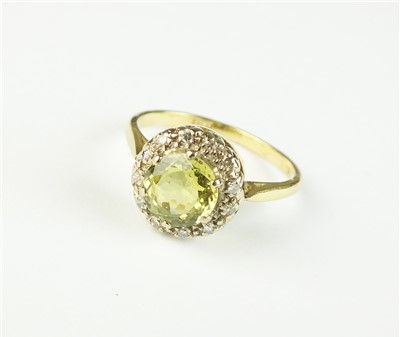 Lot 103 - A chrysoberyl and diamond cluster ring