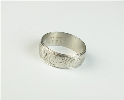 Lot 66 - An engraved white metal band