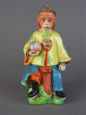 Lot 529 - A Chinese polychrome porcelain figure of a...