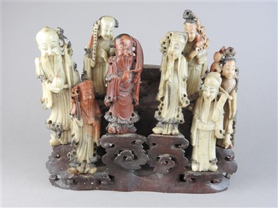 Lot 13 - A Chinese carved soapstone group of the eight...