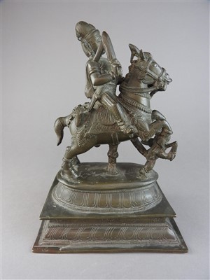 Lot 17 - An Indian bronze figure of a warrior deity on...