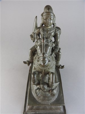 Lot 17 - An Indian bronze figure of a warrior deity on...