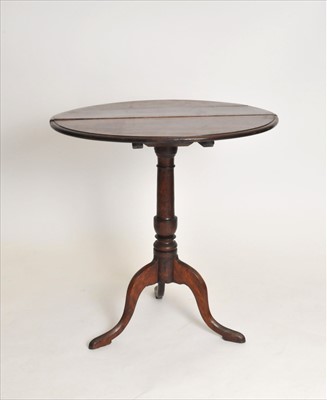 Lot 330 - A 19th century oak snap-top tripod occasional table