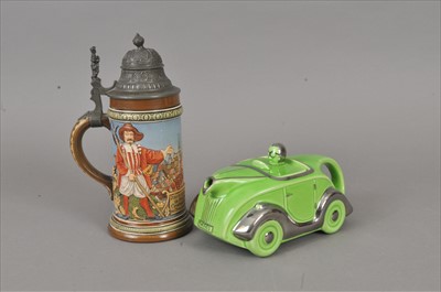 Lot 272 - Novelty racing car teapot and Mettlach stein