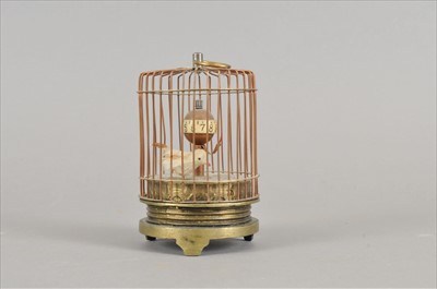 Lot 492 - A miniature lacquered brass automaton