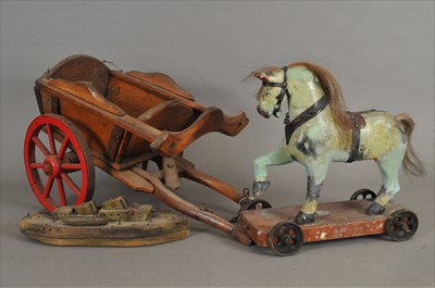 Lot 502 - An early 20th century push-along horse, a wooden cart and scratch-built naval destroyer