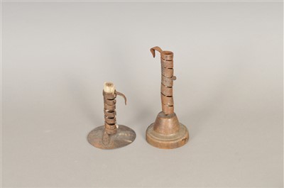 Lot 469 - Two 18th century or later sprung steel candle sticks