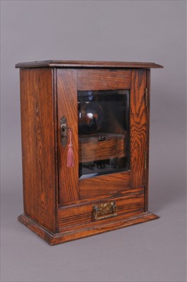 Lot 572 - A small early 20th century oak smoker's...