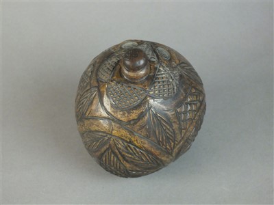 Lot 287 - 19th century 'Bugbear' carved powder flask coconut