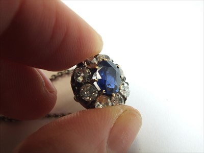 Lot 61 - A sapphire and diamond pendant