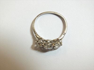 Lot 62 - A three stone diamond ring