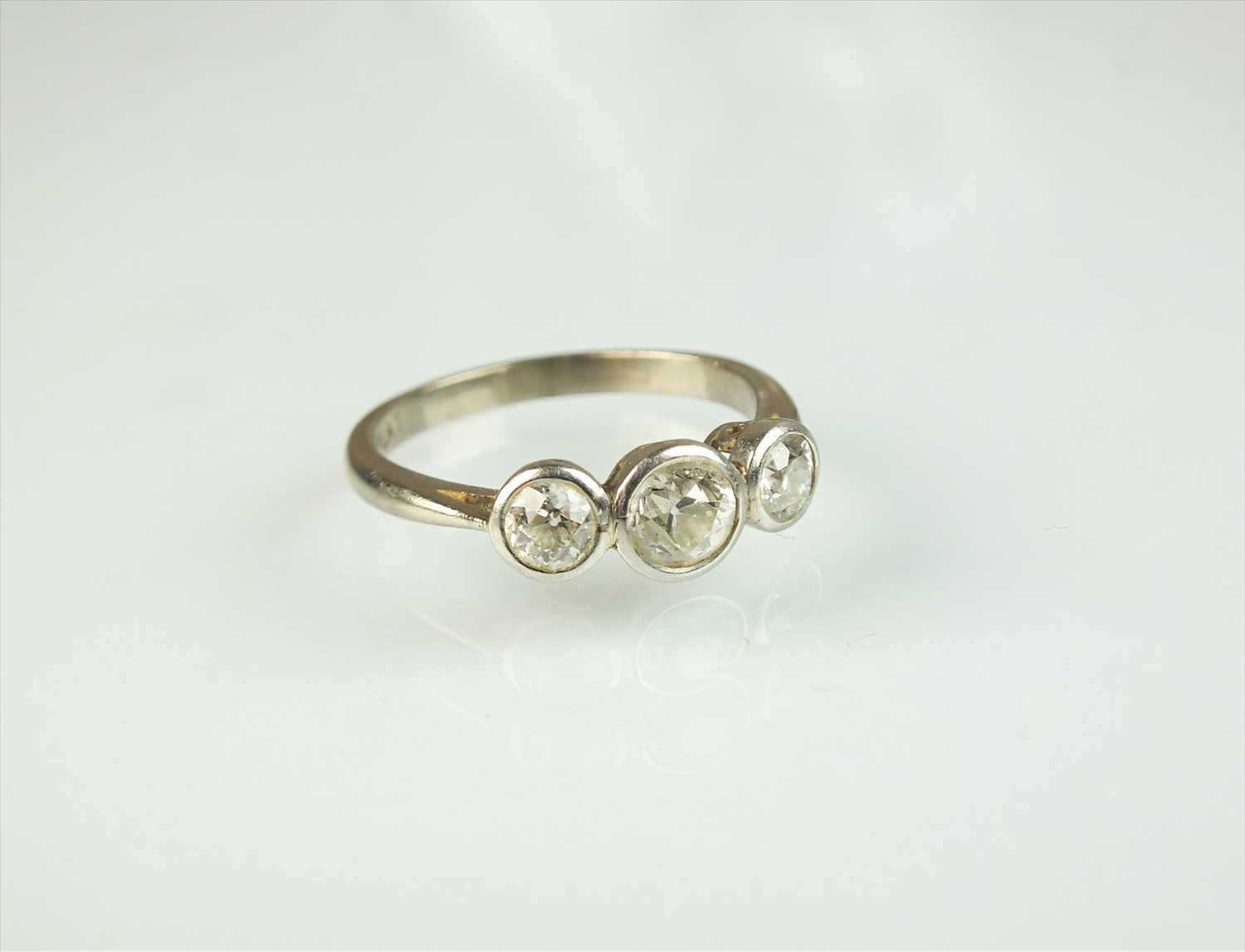 Lot 64 - A three stone diamond ring