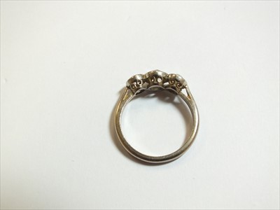 Lot 64 - A three stone diamond ring