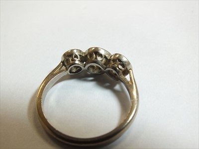 Lot 64 - A three stone diamond ring