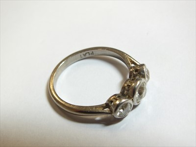 Lot 64 - A three stone diamond ring