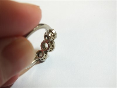 Lot 64 - A three stone diamond ring