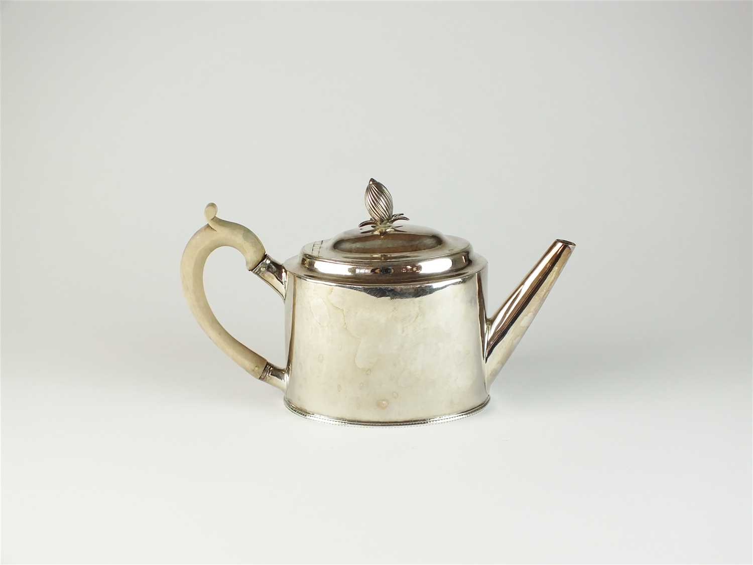 Lot 6 - A George III silver teapot