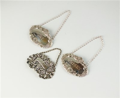 Lot 347 - Three silver decanter labels