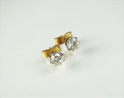 Lot 114 - A pair of diamond stud earrings