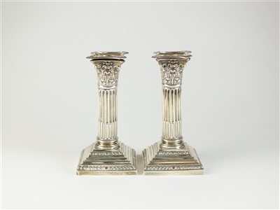 Lot 4 - A pair of silver mounted candlesticks