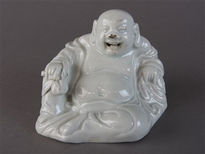 Lot 85 - A Chinese blanc de chine figure of Budai, 19th...
