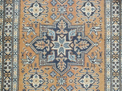 Lot 822 - A narrow Ardabil runner, the soft teracotta...