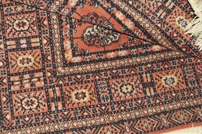 Lot 653 - A Machine made carpet, of Turkmen design,...