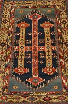 Lot 427 - A Kurdish rug, serrated indigo field with...