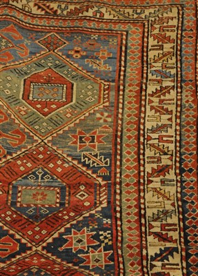 Lot 834 - Shirvan rug, the abrashed field with two...