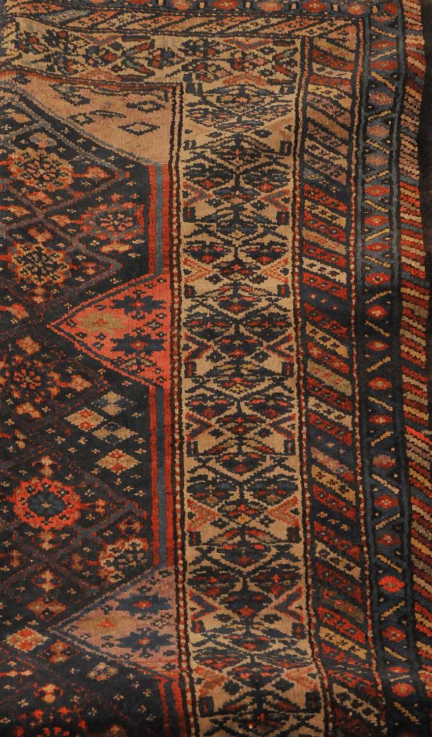 Lot 840 - A Kurdish rug, the indigo lattice field...