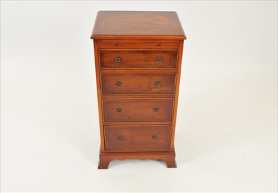 Lot 610 - A small reproduction chest of four graduating...