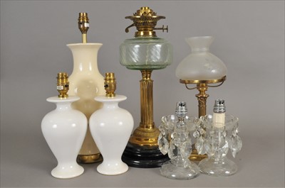 Lot 450 - An electrified Victorian brass oil lamp and further lighting