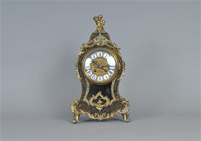 Lot 731 - A Louis XV style boulle work mantel clock