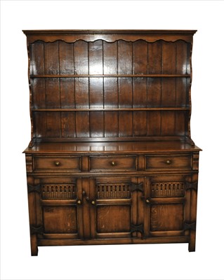 Lot 774 - A rustic old English style oak dresser and plate rack