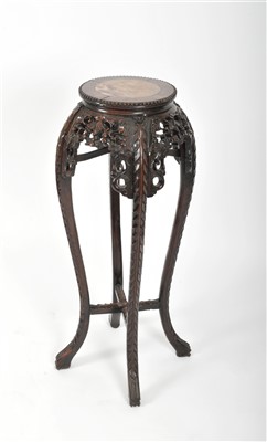 Lot 792 - A late 19th / early 20th century Chinese carved hardwood jardinière stand