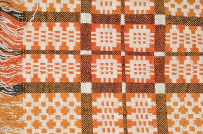 Lot 489 - A woven Welsh wool blanket in a cream and red colour way