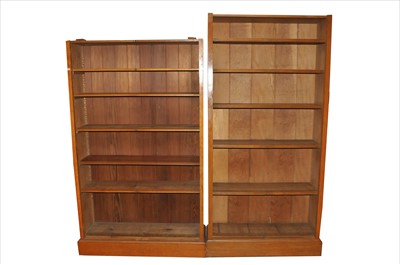Lot 370 - Two associated tall early 20th century pale oak bookcases