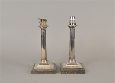 Lot 42 - A pair of silver candlesticks converted into lamps