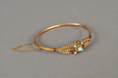 Lot 79 - An opal and pearl bangle