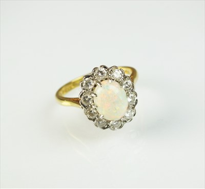 Lot 94 - An 18ct gold opal and diamond cluster ring