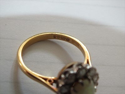 Lot 94 - An 18ct gold opal and diamond cluster ring