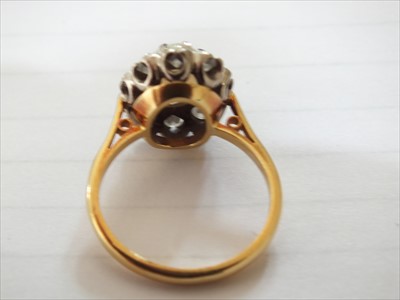 Lot 94 - An 18ct gold opal and diamond cluster ring