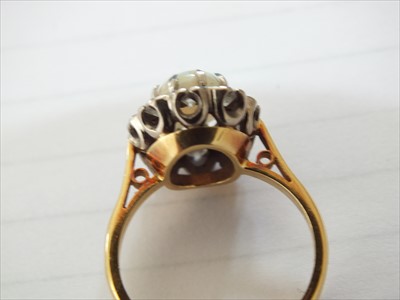 Lot 94 - An 18ct gold opal and diamond cluster ring