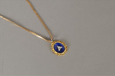 Lot 101 - An enamel and diamond pendant on chain