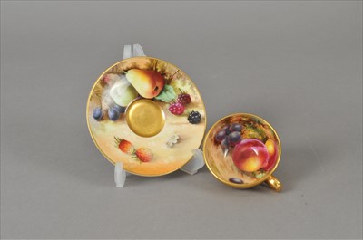 Lot 221 - Royal Worcester fruit-decorated cup and saucer