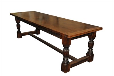 Lot 777 - A large reproduction refectory oak dining...