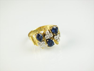 Lot 97 - An 18ct gold sapphire and diamond ring in the style of Andrew Grima